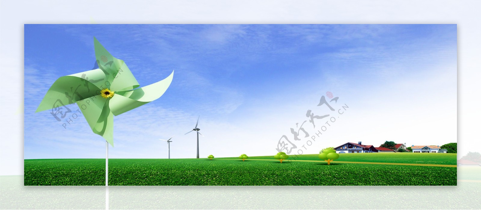 草地上的绿色纸风车背景